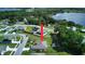 Aerial view of a single-story house near a lake at 1067 Snively Cir, Lake Hamilton, FL 33851