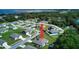 Aerial view of a single-story house in a residential neighborhood near a lake at 1067 Snively Cir, Lake Hamilton, FL 33851