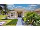 Front view of a charming house with double doors and landscaping at 1067 Snively Cir, Lake Hamilton, FL 33851
