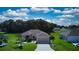 Aerial view of a house and its driveway at 1067 Snively Cir, Lake Hamilton, FL 33851