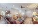 Open living room with hardwood floors and a view to the kitchen at 1067 Snively Cir, Lake Hamilton, FL 33851