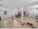 Open living room and kitchen with tile floors and an island at 14813 Camp Mack Rd, Lake Wales, FL 33898