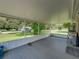 Spacious screened porch with composite decking and backyard view at 14813 Camp Mack Rd, Lake Wales, FL 33898