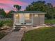 Charming cottage with a welcoming front porch and landscaped yard at 14813 Camp Mack Rd, Lake Wales, FL 33898