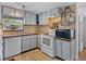 Modern kitchen with white appliances and light-grey cabinets at 14813 Camp Mack Rd, Lake Wales, FL 33898