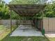 Large covered patio with concrete flooring at 14813 Camp Mack Rd, Lake Wales, FL 33898