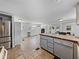 Open concept kitchen and living area with tile flooring and island at 14813 Camp Mack Rd, Lake Wales, FL 33898