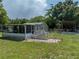 A house with a large screened porch and a fenced backyard at 14813 Camp Mack Rd, Lake Wales, FL 33898