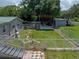 Large backyard with patio, pergola, shed, and mature trees at 14813 Camp Mack Rd, Lake Wales, FL 33898