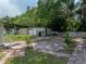 Backyard with patio, shed, and lush landscaping at 14813 Camp Mack Rd, Lake Wales, FL 33898