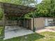 Multiple storage sheds with covered parking at 14813 Camp Mack Rd, Lake Wales, FL 33898