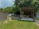 Relaxing backyard patio with covered seating and shed at 14813 Camp Mack Rd, Lake Wales, FL 33898