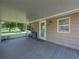 Covered porch with access to home and backyard at 14813 Camp Mack Rd, Lake Wales, FL 33898