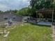 Tan house with patio, pergola, and spacious yard at 14813 Camp Mack Rd, Lake Wales, FL 33898