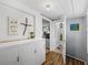 Bright hallway with built-in storage and access to bathroom at 14813 Camp Mack Rd, Lake Wales, FL 33898