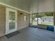Large screened porch with backyard view and access to home at 14813 Camp Mack Rd, Lake Wales, FL 33898