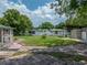 Spacious backyard with sheds and patio area at 14813 Camp Mack Rd, Lake Wales, FL 33898