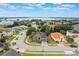 Aerial view of the home in the neighborhood with nearby lake at 329 Lake Vista Dr, Auburndale, FL 33823