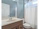 Bathroom with single vanity, toilet, and shower/tub combo at 329 Lake Vista Dr, Auburndale, FL 33823