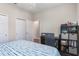 Bedroom with double closet, desk workspace, and private bathroom access at 329 Lake Vista Dr, Auburndale, FL 33823