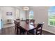 Inviting dining area with natural light, a dining table, and access to the foyer at 329 Lake Vista Dr, Auburndale, FL 33823