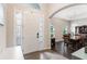 Bright entryway with tile flooring, arched doorways, and a view of the dining area at 329 Lake Vista Dr, Auburndale, FL 33823