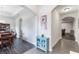 View of the entryway with arched doorways leading to the dining area and living room at 329 Lake Vista Dr, Auburndale, FL 33823