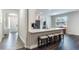 Modern kitchen with granite countertops, stainless steel appliances, and bar seating at 329 Lake Vista Dr, Auburndale, FL 33823
