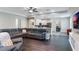 Spacious living area with a sectional sofa and open sightlines to the kitchen and dining area at 329 Lake Vista Dr, Auburndale, FL 33823