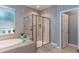 Main bathroom with soaking tub, walk-in shower, and single vanity at 329 Lake Vista Dr, Auburndale, FL 33823
