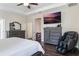 Main bedroom with a ceiling fan, TV, massage chair, and a walk-in closet at 329 Lake Vista Dr, Auburndale, FL 33823