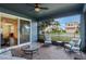 Screened porch with seating area, pavers, and view of the neighborhood at 329 Lake Vista Dr, Auburndale, FL 33823