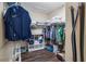 Organized walk-in closet with shelving, hanging rods, and storage containers at 329 Lake Vista Dr, Auburndale, FL 33823