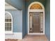 Elegant entryway with arched transom and door at 329 Lake Vista Dr, Auburndale, FL 33823