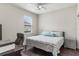 Bright bedroom with a king-size bed, a workspace, and plenty of natural light at 329 Lake Vista Dr, Auburndale, FL 33823
