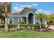 Stunning curb appeal with lush landscaping at 329 Lake Vista Dr, Auburndale, FL 33823
