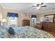 Bright bedroom featuring a king-size bed and ample natural light at 1521 Oakview Se Cir, Winter Haven, FL 33880
