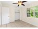 Bright bedroom with ceiling fan and a window overlooking the backyard at 1165 E Church St, Bartow, FL 33830