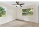 Light and airy bedroom featuring tile flooring and a ceiling fan at 1165 E Church St, Bartow, FL 33830