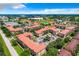 Aerial view showcasing community pool and buildings at 902 Charo Pkwy # 624, Davenport, FL 33897