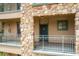 Exterior view of building with stone accents and a balcony at 902 Charo Pkwy # 624, Davenport, FL 33897