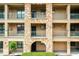 Exterior view of building showing stonework and balconies at 902 Charo Pkwy # 624, Davenport, FL 33897