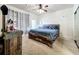 Spacious bedroom with a large bed and ceiling fan at 902 Charo Pkwy # 624, Davenport, FL 33897
