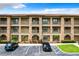 Building exterior with stone accents and multiple balconies at 902 Charo Pkwy # 624, Davenport, FL 33897