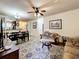 Living room with sofa, coffee table and large area rug at 902 Charo Pkwy # 624, Davenport, FL 33897