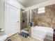 Bathroom with a soaking tub, walk-in shower, and separate toilet at 902 Charo Pkwy # 624, Davenport, FL 33897