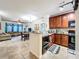 Modern kitchen with granite countertops and dark wood cabinets at 902 Charo Pkwy # 624, Davenport, FL 33897