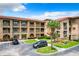 Exterior view of building showcasing stone accents and balconies at 902 Charo Pkwy # 624, Davenport, FL 33897