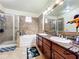 Double vanity bathroom with soaking tub and walk-in shower at 902 Charo Pkwy # 624, Davenport, FL 33897