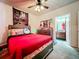 Bedroom with full bed, ceiling fan, and adjacent bathroom at 902 Charo Pkwy # 624, Davenport, FL 33897